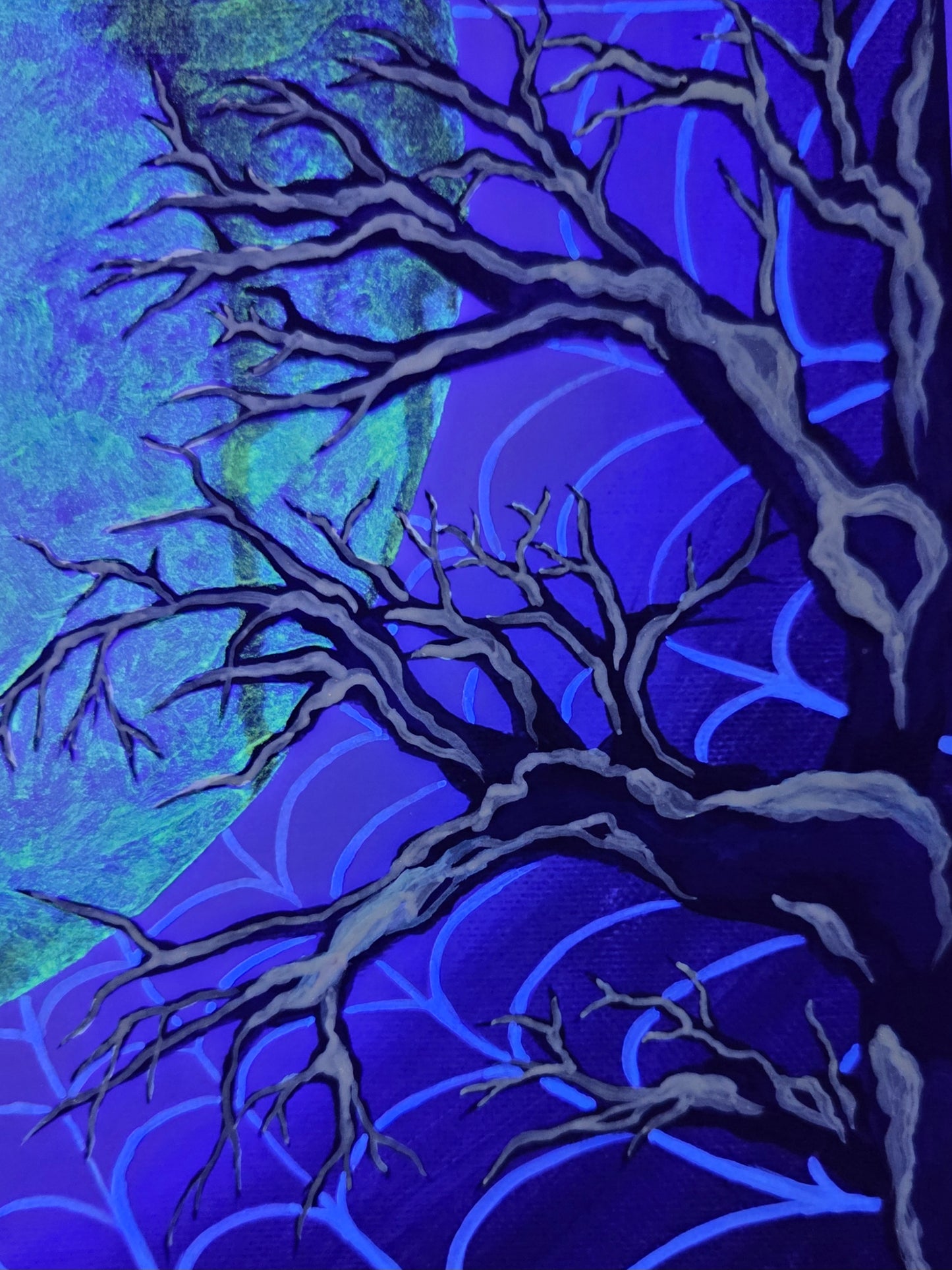 Artistic depiction of a tree with bare branches against a blue and purple abstract background