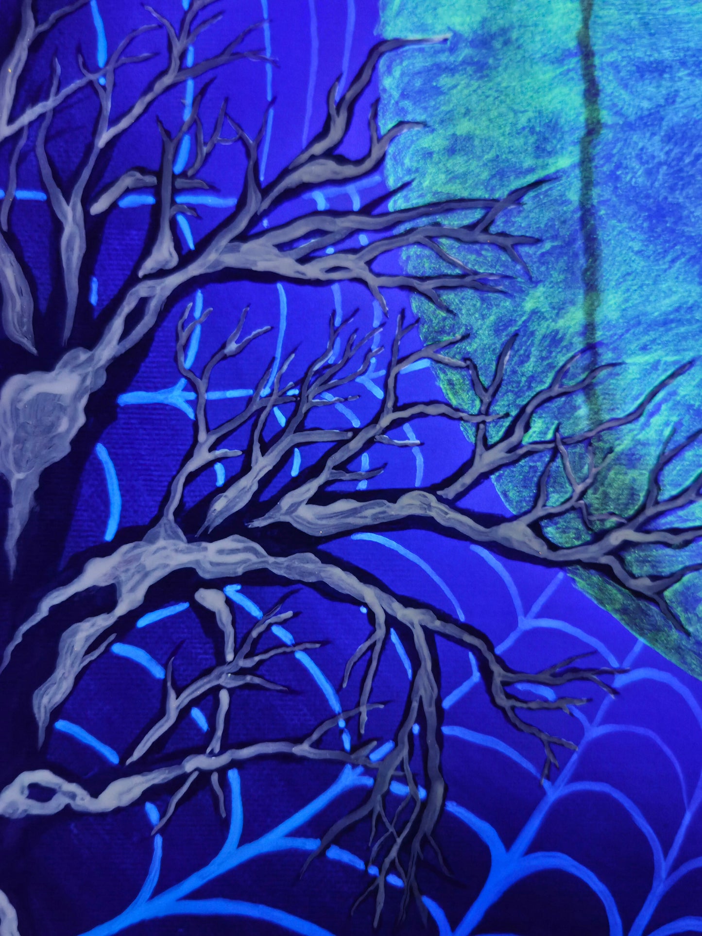 Artistic depiction of bare tree branches against a blue and green abstract background