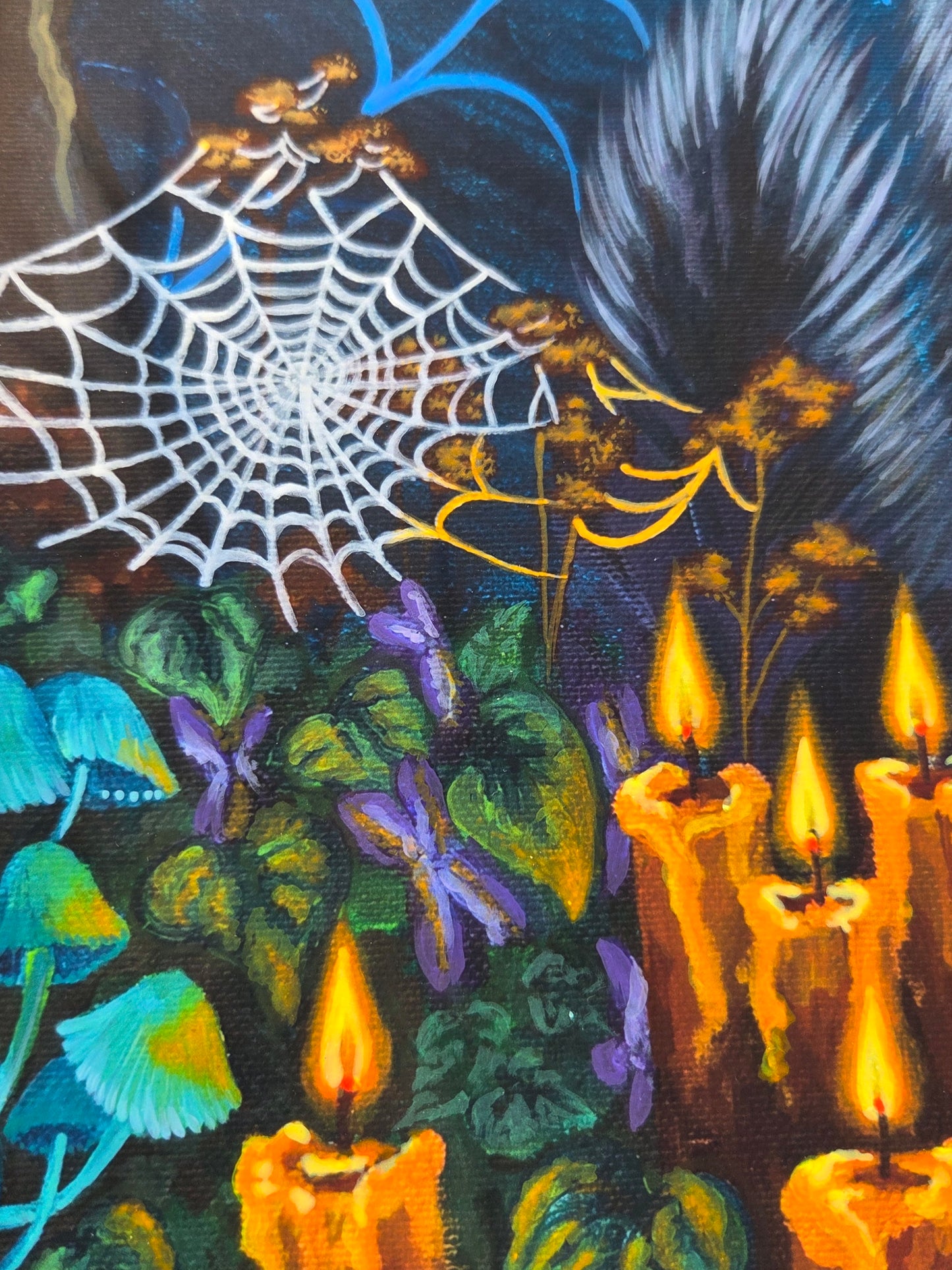 Festive fabric with candles, spider web, and decorative elements on a dark background